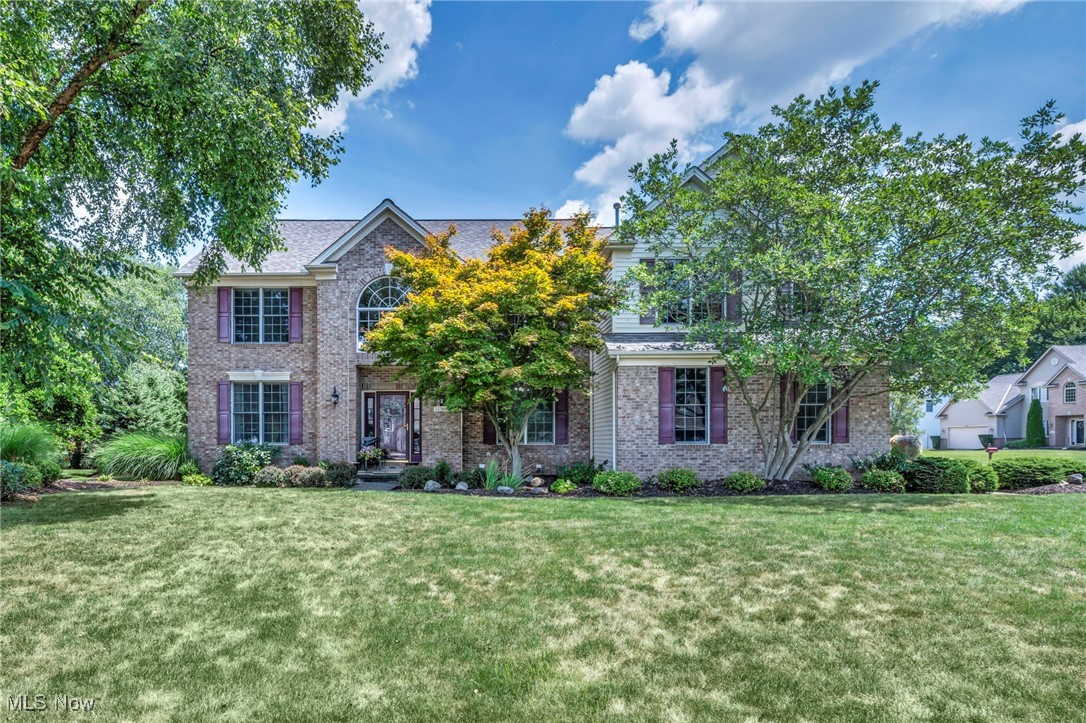 Welcome to this stately Brick Front Colonial nestled in Strongsville’s highly sought-after Westwood Farms Community. With exceptional curb appeal, an oversized side-load 2 car garage, over 3,300 sq.ft above grade, plus over 1,000sq.ft finished basement this home is sure to please! Inside, the thoughtful floorplan blends warmth and openness, beginning with a dramatic 2 story foyer w/ French doors that open to a private office. The living & dining rooms offer an ideal setting for hosting formal gatherings, while the heart of the home, the spacious eat-in kitchen impresses w/ classic white cabinetry, granite counters, a stylish backsplash, center island w/ seating, & a sunny dining area. The vaulted family room is filled w/ natural light & anchored by a cozy gas fireplace, creating the perfect spot for relaxing evenings. Upstairs, 2 staircases lead to 4 well-appointed bedrooms & 2 full baths, including a vaulted primary suite complete w/ a sitting area, 2 walk-in closets, & a luxurious spa-like bath featuring dual vanities, a walk-in shower, & a large tub. The finished basement is a true bonus, offering a generous recreation area ideal for movie nights, a game space w/ a pool table, a large wet bar for entertaining, a convenient half bath, & ample storage. Step outside to a private backyard retreat surrounded by mature landscaping. Enjoy outdoor living at its finest on the sprawling paver patio w/ a built-in firepit, or unwind after a long day in the hot tub. As part of the Westwood Farms community, you'll have access to the community pool, clubhouse, playground, scenic pond, and tennis courts. Recent updates provide peace of mind and include a new water heater (2023), LVP Flooring(2022), microwave, dishwasher and disposal (2022), A/C and garage opener (2017), furnace (2013), and a brand new roof August 2025! This is a rare opportunity to own a beautifully maintained and spacious home in one of Strongsville’s premier neighborhoods!
