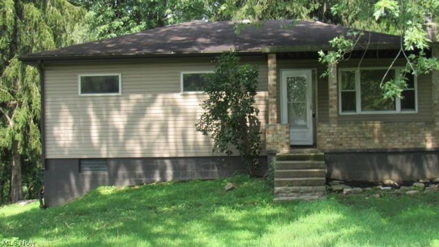 This charmer has loads of potential! Perfectly poised on a relatively level lot, this home offers much curb appeal. Don't let this one pass by. Call today for your showing!