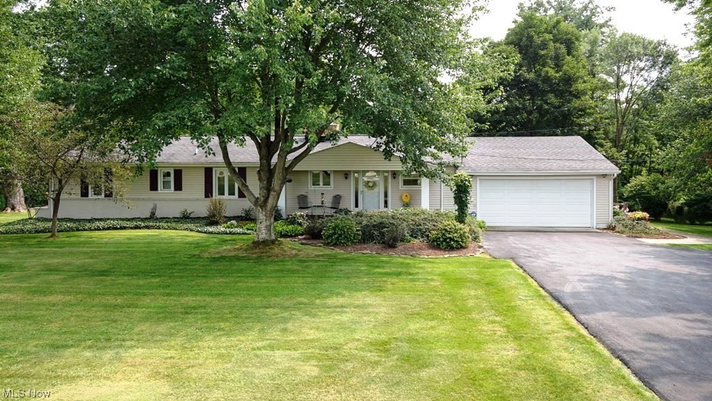 This is the one of a kind property you’ve been searching for! Updated throughout, this meticulously maintained ranch is situated on a beautiful lot overlooking a picturesque pond AND there is an outbuilding! With a perfect blend of modern comfort and timeless charm, you will be immediately impressed by the tasteful upgrades and attention to detail. There are hardwood floors throughout and natural light flooding in from large windows with picture perfect views. The living area is spacious and features a cozy gas fireplace. The kitchen has been thoughtfully remodeled and equipped with stainless steel appliances, granite countertops, and plenty of storage. An adjacent dining area provides the perfect setting for entertaining or just enjoying daily meals. There are three bedrooms and an updated full bath with double sinks and modern shower. The outdoor paradise is designed to be appreciated in every season. The sunroom leads to the outdoor space with a maintenance free deck and patio, wher