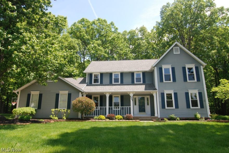 Gorgeous updated Colonial in the Woods of Williamsburg.  Large professionally landscaped lot is wooded and private and backs up to a meadow and golf course.  Great open floor plan, wide family room w/fireplace, office, kitchen with eating area with slider that opens onto a sprawling deck.  Cathedral master bedroom with updated bath.  Gorgeous 6 panel wood doors.  Spectacular craftsmanship.  Updates galore!  Newer roof, furnace, carpet, tile, hardware, updated baths, kitchen and more!