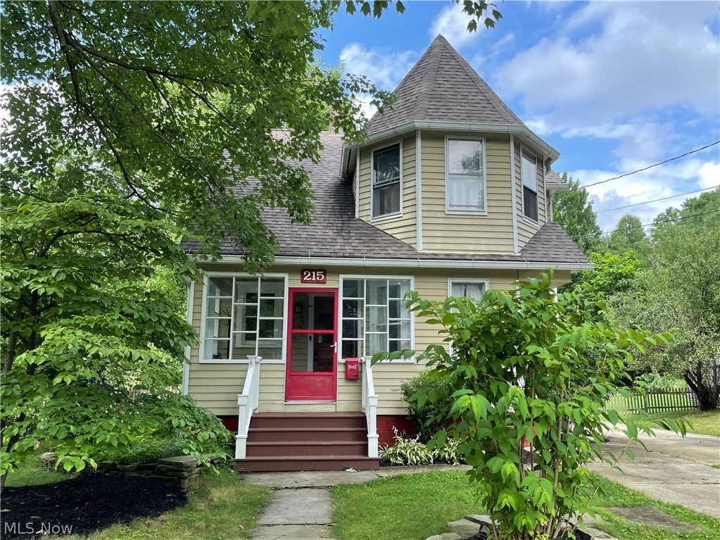 Welcome to historic Kent, Ohio & the Victorian charm of this wonderful 1901 Queen Anne on East Elm! From the castlesque turret to the refinished living/dining floors to the fully remodeled kitchen, you are going to Fall.In.Love! Situated within comfortable walking distance of Kent State University and the revitalized downtown restaurant & entertainment district, yet tucked away on a less-traveled street, the location couldn't be better! You'll love the timeless architecture and the gorgeous, deep semi-private back yard (which, with a small section added, will be fully fenced)! How about on-demand hot water from a newer tankless heater? (You'll love that too!) Roof replaced June, 2012. West basement foundation work completed in 2017 by prior owner; approved by City of Kent building department (both documents available). The detached, deep "tandem garage," is stable, huge and functional! The charm of this home is in the details such as the long windows, well-placed kitchen storage, back