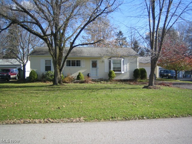 Nice home with newer siding & appliances. Hardwood floors. Two car garage, fenced back yard, deck, storage shed and full basement. Home Warranty