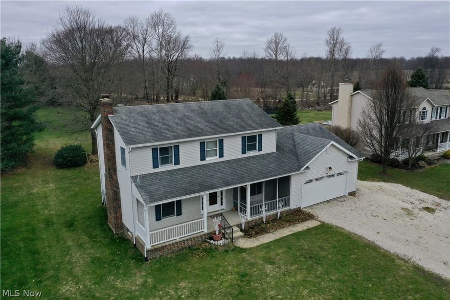 Lake Township!! 2 Acres!! Low Utilities!! One owner home built by Joe Hershberger Construction!! Well maintained & Clean! This 3 BR, 2.5 car garage colonial style home has a country setting & flowing floor plan! Carriage oak cabinets & trim throughout! It is spacious with tons of storage including a 16X20 Barn in back! This two story is inviting with hard wood flooring in the foyer & dining area! The great room is open & features a built in brick fireplace with gas logs & recessed lighting! It has a Large 21x12 Eat in kitchen with sliding door to wooden deck over looking backyard! First floor laundry! This home offers a master suite with vaulted ceilings , double walk in closets &  new luxury vinyl flooring in master bath! All Closets have plenty of space for storage! There is a finished rec room, storage & utility area in the basement as well! Anderson Windows!! Low Utilities!! Appliances, Builders paperwork & oil/gas rights convey! Call us today!