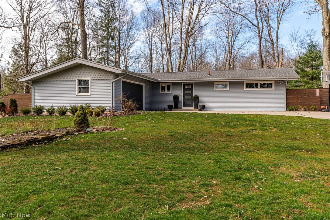 This fully-renovated 3-bed 1.5-bath ranch on a cul-de-sac offers a serene, private retreat with all the modern amenities you need. Step into the breathtaking great room with vaulted ceilings, where floor-to-ceiling windows frame a picturesque view of nature. The kitchen is a dream, including a massive island which comfortably seats six, plentiful storage, and a generously sized pantry. The main bathroom is a luxurious oasis, with double vanity, custom tile work, a multitude of storage options, and a soaking tub for unwinding after a long day. The finished basement offers a versatile amount of space to accommodate all the needs of your family, including a bonus room with massive walk-in closet, currently being used as a 4th bedroom. Plus there is an additional bonus/flex space, an ample sized family room with reading nook, along with a large laundry/utility area. Perfectly sited for maximum privacy, this beautifully landscaped home overlooks a peaceful lake. Experience the tranquility of nature from your outdoor living space featuring a custom pergola, ornamental trees for gorgeous color, a mature maple that offers shade, and landscape lighting for a magical ambiance. The attached two-car garage offers ample additional space, perfect for storage or transforming into a workshop. A raised-bed garden with drip irrigation offers tons of growing space. Come experience the beauty of this truly exceptional property. Other improvements include updated electrical, Kinetico water system, spray foam insulation, newer windows, complete lawn renovation, fresh paint, and more.
