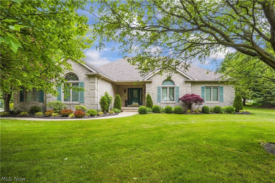 The one you've been waiting for!!! Original owner selling all brick Ranch with 3 bedrooms, 2-1/2 baths, attached 3-car garage on .62 acres with view of lake. Entrance foyer with ceramic tile floor and wall of closets opens up to cathedral ceiling, oak gas fireplace in great room w/2 skylights and ceiling fan w/neutral carpet, paint and natural oak woodwork. Open floorplan leads to eat-in kitchen with corner sink, hardwood floor, cherry cabinets, Cambria countertops, two-tier island w/electric, walk-in pantry, built-in hutch, built-in desk and door to screened in sunroom/porch. Kitchen is right off the door from attached 3-car garage, laundry room and half bath. Down the hall is the huge master bedroom with tray ceiling, ceiling fan/light, neutral carpet and paint, walk-in closet and roomy master bath with two granite vanities/sinks, jetted tub, walk-in shower with seat and sliding glass doors, and linen closet. Additional two bedrooms, one currently used as an office, both with double closets and ceiling fans/lights. Main bath has long vanity, tub, separate shower and linen closet with another double closet in the hallway. Solid wood 6-panel doors throughout the house. Laundry room has utility sink, cupboards, counter, closet and built-in ironing board. Screened-in sunroom/porch connects to wood deck, both overlooking backyard and lake shared by several homes. Basement has wall gas heater, utility sink, glass block, sump pump, 200 amp electric, water treatment system, circulating hot water system, whole house vac, built-in shelves, painted floor and two additional rooms. Attached 3-car garage has hot/cold water, drains and opener. Updates include roof 2013, furnace and a/c 2013, H2O 2015, kitchen 2013, master bath 2017, gar door 2015, ALL new wood windows 2022.  Staying are all kitchen appliances, washer/dryer, freezer, pool table, snowblower, computer desk, great room tv cabinet, gray cabinets and workbench in garage.  Make your appointment today before it's gone!!