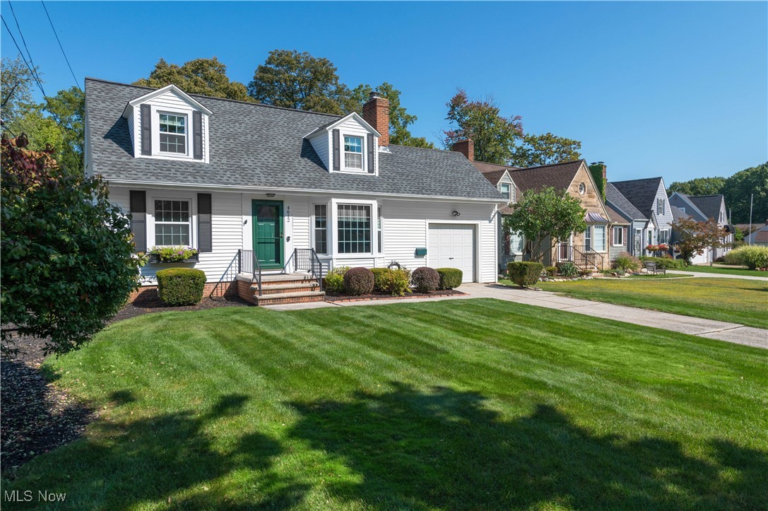 Welcome to this inviting 3-bedroom Cape Cod that blends charm with modern updates. The living room greets you with gleaming hardwood floors, a bay window, cove ceiling, and a cozy gas fireplace. The eat-in kitchen is updated, featuring quartz countertops, stainless steel appliances, abundant cabinet and counter space, and a classic subway tile backsplash. The spacious family room boasts a vaulted ceiling, large bay window, and access to the delightful backyard deck, perfect for relaxing or entertaining. The first floor offers two bedrooms with hardwood floors, including the primary, plus a full bath with a cultured marble sink, ceramic tile flooring, shower over tub, and excellent storage. Upstairs you'll find a generous third bedroom with a vaulted ceiling, a wall of closets, and room for an office nook or reading space. The lower level adds more living space with a finished rec room and glass block windows. Step outside to enjoy the low-maintenance composite deck overlooking the welcoming backyard. An attached 1-car garage completes this wonderful home. This home is centrally located and close to Bain Park and the Metro Parks. The seller is offering a one year home owner warranty.