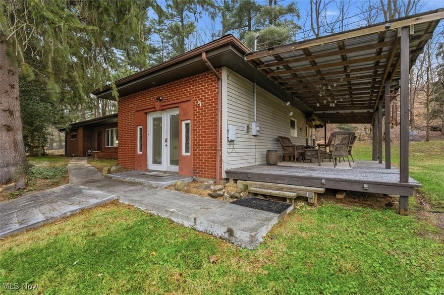 Check out this brick ranch on a 2 acre park-like setting in Vienna outside of the city limits.  This inviting  3 bedroom, 1.5 bath home offers all first floor living, a sun room, large covered deck, and back patio...perfect for enjoying every season.  Detached 2-car garage, new concrete driveway, new water and sewer lines, and a roof approximately 10 years old add value and peace of mind. A cozy, well-maintained home with space to relax and room to roam. Be sure to check out this home and its private setting, yet still the close convenience to shops & restaurants.