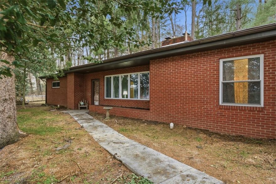 Check out this brick ranch on a 2 acre park-like setting in Vienna outside of the city limits.  This inviting  3 bedroom, 1.5 bath home offers all first floor living, a sun room, large covered deck, and back patio...perfect for enjoying every season.  Detached 2-car garage, new concrete driveway, new water and sewer lines, and a roof approximately 10 years old add value and peace of mind. A cozy, well-maintained home with space to relax and room to roam. Be sure to check out this home and its private setting, yet still the close convenience to shops & restaurants.