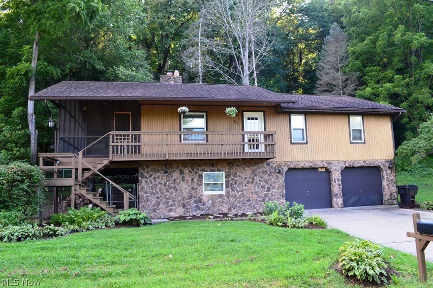 River Property with beautiful views.  New roof and HVAC 2012. Oversized screened in porch offers a fantastic view of the river for relaxing and entertaining located just off front porch or entry to kitchen.  Family room and rec room both offer a wood burning stove, rec room leads you to ground level patio and fenced in yard area and offers half bath for easy access from a day on the river, family room exits to covered front porch and overlooks the river.  Master offers double closets with master bath. . There is a deck sitting on the river side.  2 car garage with concrete driveway.