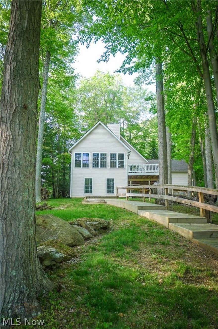 Motivated sellers, make offer. Stunning lakefront home features 5 bedrooms, 3 full baths, 2 car garage, full finished walkout lower level, cathedral ceilings and a beautiful stone wood burning fireplace. Invite family and friends and entertain for days in this beautiful fully furnished home. Spacious open kitchen with a nice island and living room with adjoining dining/sitting room surrounded with windows to enjoy the view of the lake. Enjoy the privacy with the master suite located upstairs. Two guest bedrooms located on the main floor with a full bath, additional 2 bedrooms and a full bath located in the lower level along with a nice family room and laundry. So much natural light pours into this home. Concrete drive, nice decking, boat dock, patio off the lower level and so much more. Truly a must-see home. Relax and start your lake living today. Located at the Valleywood Heights and Baldwin Heights cove. MATOVATED SELLERS, MAKE OFFER.