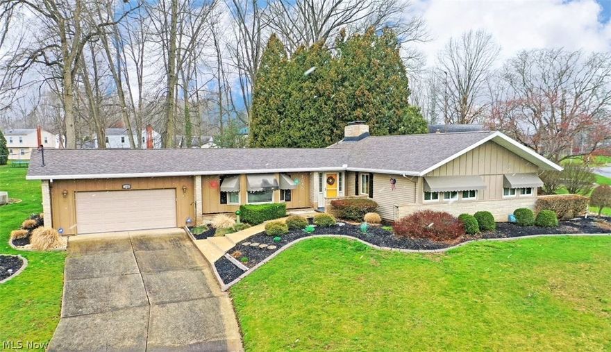 Proudly sitting atop its prominent corner lot, this gorgeous ranch in Howland school district proudly showcases its unmatched looks and expertly manicured landscaping! One look is all you need to draw you near, making your way up the rising cement sidewalk and into the brick lined entry door. Inside, a gracious foyer extends out with hardwood styled flooring as the rising ceilings give way to the nearby dining room. Lush carpets fill the adjacent living room with its unique, bay styled window that sheds plenty of natural light. For brighter relaxation, enjoy the accompanying sunroom--which has electric heat--with its scenic backyard views. Fall in love with the gorgeous central kitchen, filled with custom wood cabinets, pull-out shelves and two lazy-susans, stone-look countertops and additional brick accents. Around the corner, the family room delights with a cozy gas fireplace and rear patio access. Further down the main hall, a trio of welcoming bedrooms are joined by a lovely full bath with its handsome wooden vanity, whirlpool tub and tasteful tile work. The primary bedroom completes the package with its own full private bath which has a walk-in shower, high toilet and solid-surface counter/sink. Down below, a full basement includes laundry services, storage and workshop space along with a second kitchen.  Electric updated (including outlets installed on the deck), roof new 2022, new hot water tank 2021, furnace and A/C 2016, sliders 2019, kitchen & LV windows 2023, all other windows 2015.  Pre-approved buyers only.