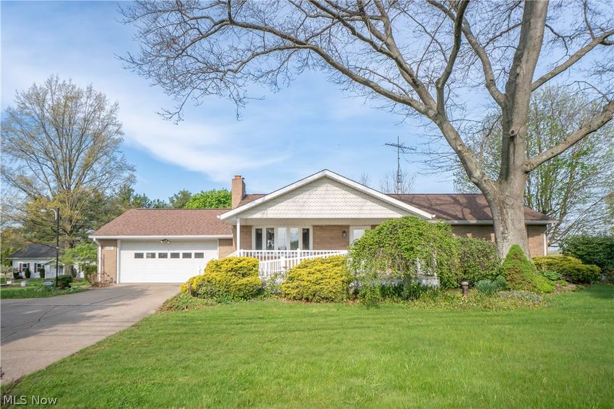 Welcome to this spacious brick ranch in Louisville, set on a comfortable .55-acre lot with a beautifully landscaped yard, a covered front porch with a wheelchair-accessible ramp. Inside, the living room offers a warm and inviting feel with bay windows and a floor-to-ceiling brick gas fireplace. The eat-in kitchen features a breakfast bar, built-in desk, ample closet storage, and included appliances. Just off the kitchen, the enclosed sunroom adds a relaxing extra living space with a brick accent wall, ceiling fan, and walkout access to the patio and backyard. Three main-level bedrooms share a thoughtfully designed full bath offers a separate vanity area for added privacy and functionality. The full unfinished basement provides great storage and utility space, along with laundry hookups, a second full bath with shower, wood-burning fireplace, laundry chute, and waterproofing for added peace of mind. Additional highlights include an attached 2-car garage, 16x20 garage/barn with electric and water, Vac-U-Flo system, whole-house generator, new sump pump, water softener, well, and septic. Schedule your showing today!