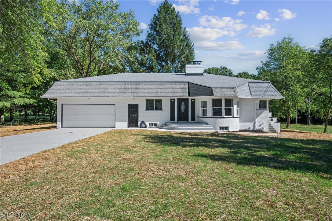 Fully renovated Ranch located on over .73 acres in Seven Hills, featuring a newly connected public city sewer and thoughtful updates throughout. This 3-bedroom, 2-bath home offers more than 2,699 sq ft of living space, including a finished basement with multiple flexible spaces. The open layout highlights a stunning kitchen with quartz countertops, all new stainless steel appliances, and a breakfast nook framed by a circular wall of windows. The living room showcases a dramatic floor-to-ceiling tiled fireplace, while a formal dining room provides flexibility for entertaining, a home office, or additional living space. Both full baths have been completely renovated, the primary with a soaking tub and the guest bath with a tiled walk-in shower. An attached tandem 3-car garage features a front-facing 2-car door and a rear-facing 1-car door that opens to the expansive backyard. UPDATES COMPLETED IN 2025 include: Replaced HVAC, windows, all kitchen appliances, concrete driveway, updated electrical and plumbing, fully updated kitchen and baths, replaced flooring, tile, trim, all doors including garage door with motor, and re-planted grass. INCLUDED are ALL kitchen appliances. Conveniently located near I-77, OH-176, Seven Hills Rec Center, Hillside Middle School, and plenty of shopping, restaurants, parks, and other local attractions. This home is a must see...
