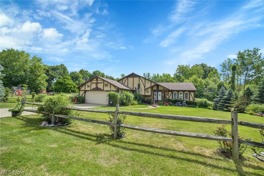 Nestled on a serene parklike lot, this multi-level home boasts an open floor plan with spacious rooms designed for modern living. The first level features a welcoming living room, a formal dining room, a well-appointed kitchen with an eat-in area, and a sunroom/enclosed porch that offers stunning views of the lush backyard and surrounding nature. Upstairs, the primary bedroom includes a private bath and a generous closet, complemented by two additional bedrooms and another full bath. The lower level provides a cozy family room with a fireplace, a laundry area, a full bath, and a bar area for entertaining. The basement is a highlight, featuring a recreation room that opens to the backyard. Vaulted ceilings and abundant natural light enhance the home's airy ambiance. Conveniently located close to LCCC, highways, and shopping, this home offers easy access to all amenities.