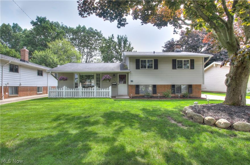 Don't miss out on this meticulously maintained 5 bedroom split level within the Mayfield City School District. Newly updated kitchen remodel 2016 and both bathrooms redone in March 2019. All newer appliances which will remain, newer furnace, new fence (3 years old), spacious 2 and 1/2 car garage, new paint, and new flooring in 2016 throughout family room. Dining room with vaulted ceilings and Pella slider to patio for ease of entertaining. Living room with vaulted ceiling and bayed window for natural lighting, great for family gatherings. Main bath with skylight, jacuzzi tub and corner shower. Two rooms in lower level both paneled with well maintained carpeting. Rec room in lower level. Detached 2.5 car garage with all newer cement floor, cement drive and newer cement back patio. Beautiful white front picket fence, gutter guards and BRAND NEW vinyl siding. Mature, manicured lawn and shrubbery. Convenient location, close to shopping, restaurants and freeways. Schedule your showing now a