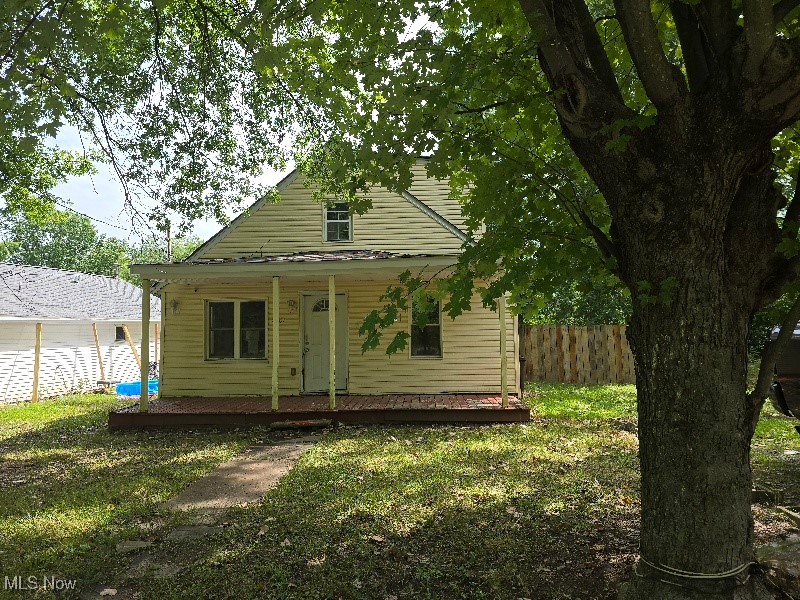 This 3-bedroom, 1-bath Cape Cod is full of potential and ready for your personal touch. Features include a spacious kitchen, inviting living room, cozy sitting room, office space, and convenient first-floor laundry. Two bedrooms are located upstairs, offering privacy and flexibility. The home sits on a slab foundation, has a fenced yard, and comes with an extra lot included—perfect for expansion, gardening, or outdoor enjoyment. While there’s no garage, there’s plenty of room to create the setup that fits your needs. Being sold as-is.