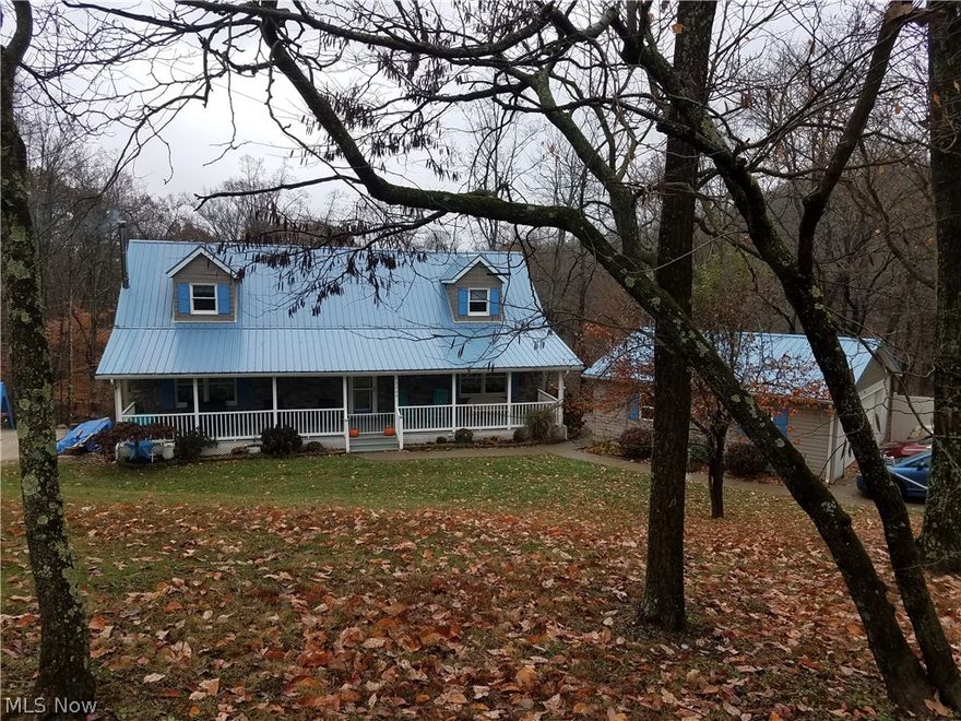 Fantastic house in a beautiful country setting! This beautiful home features nearly 1000 square feet of upper and lower level decks on which to entertain, relax, and enjoy the gorgeous wooded view. The main level includes a cozy living room, kitchen, large dining room with sliding doors to the upper deck, master bedroom, full bathroom and laundry room that is currently used as a pantry. Upstairs are two large bedrooms and a Bonus sitting room. In addition, there is a large closet that could be an additional bathroom. The finished section of the lower level has a second bathroom, and a sizable family room that walks out onto the lower level deck and patio. The unfinished portion of the lower level offers plenty of storage space, a second laundry area, and a wood burner used to heat the entire home. In addition, there is an electric furnace that was installed in 2011 along with Central A/C. There is also a two car, detached garage, and a storage shed.