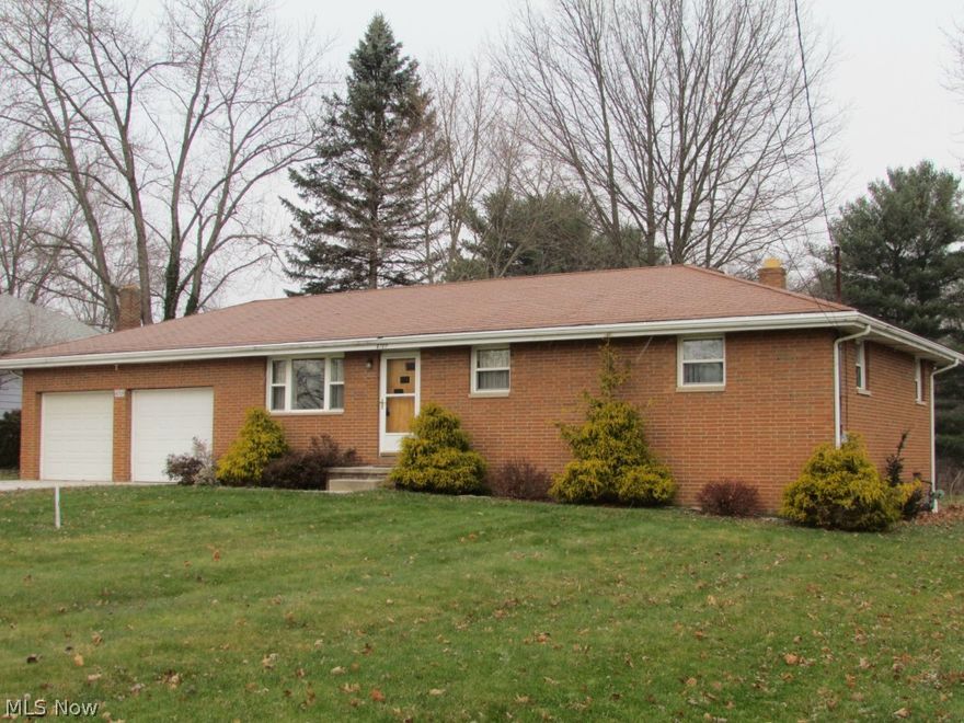 Move-in ready brick ranch in Ravenna Township on nearly one acre includes three bedrooms and two full bathrooms.  Square footage does not count the finished basement which features a spacious rec. room that also has a kitchenette.  New carpet.  Beautiful hardwood floors.  Appliances stay.  Newer high efficient furnace in house, separate newer H.E. furnace in heated garage.  Two car wide concrete drive leads to two car attached garage which has access to home.  Well insulated with low utility records.  Economical living in this low maintenance home.  Great location off 44/5 by-pass with quick access to 1-76 (Akron-Canton-Youngstown) and SR 14 (Streetsboro-Cleveland).  Schedule your showing today!