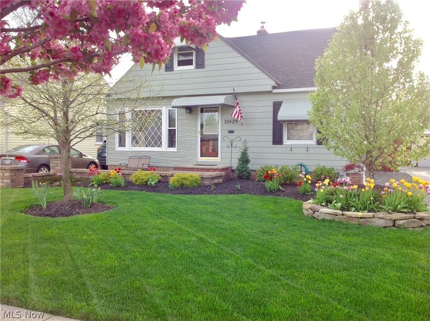 You will be amazed by this immaculately kept and updated bungalow, located on a large private lot! This home has been meticulously updated over the recent years. The kitchen features newer maple cabinetry, countertops, mosaic backsplash, stainless steel appliances, and ceramic floors. The huge family room addition off the back of the home adds 400 square feet of extra living space, has hard surface flooring, and a custom wainscoting and slate fireplace. Both bathrooms have been renovated with new tile flooring, new vanities, and fixtures. Two generously sized bedrooms are on the first floor, with a large master bedroom located upstairs with a sitting room, built-ins and ample closet space. The gorgeous finished basement is massive with nature stone flooring, dry bar, and stacked stone gas fireplace, perfect for large gatherings!  Off the family room is the large patio, opening to the professionally landscaped yard with your own above ground pool and deck! The backyard is truly your own oasis! This home also includes a 2 car garage, new vinyl windows, roof, furnace, concrete driveway, landscaping, waterproofing, security system, landscape lighting, and irrigation system! Make this house your home TODAY!