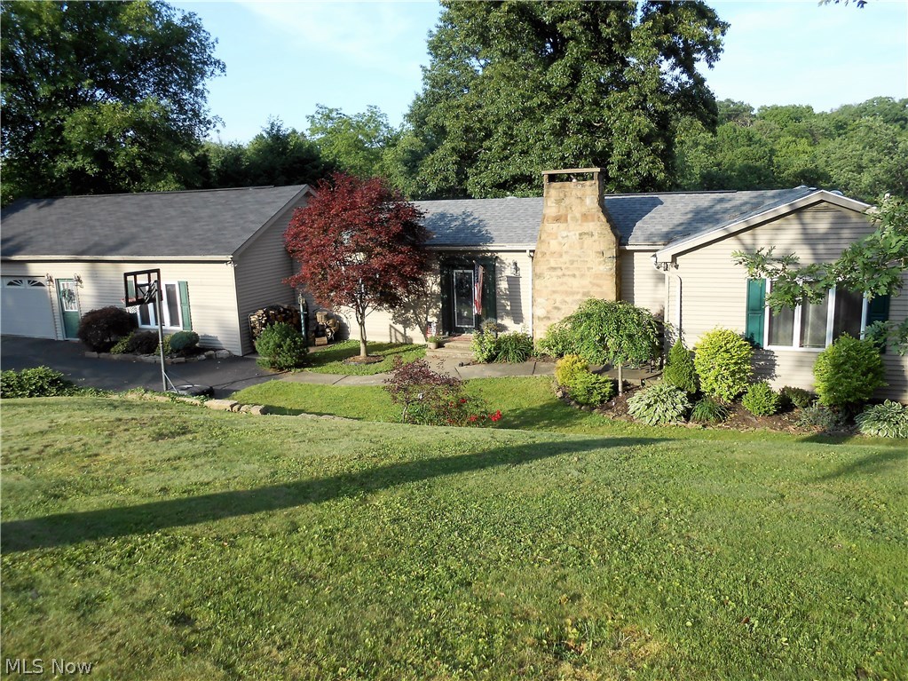 WOW IS ALL I CAN SAY ABOUT THIS LARGE HOME...1.48 ACRE LOCATED IN STEUBENVILLE CORP LIMITS..GREAT PATIO OVERLOOKING VERY PRIVATE BACK YARD. KITCHEN IS AN EAT IN KITCHEN WITH ISLAND PLUS A LARGE OPEN DINING ROOM ATTACHED. LIVING ROOM PLUS A FAMILY ROOM ON 1ST FLOOR.
3 BEDROOMS ON 1ST FLOOR ONE BEING A MASTER BEDROOM WITH PRIVATE BATH ALONG WITH 4TH IN THE LOWER WALKOUT BASEMENT. TONS OF STORAGE: LAUNDRY ROOM, WORKSHOP,PROJECT ROOM,BASEMENT GARAGE PLUS AN OPEN COVERED AREA IN THE BACK. RENOVATIONS TOO LONG TO LIST . PLEASE CALL OFFICE FOR LIST.