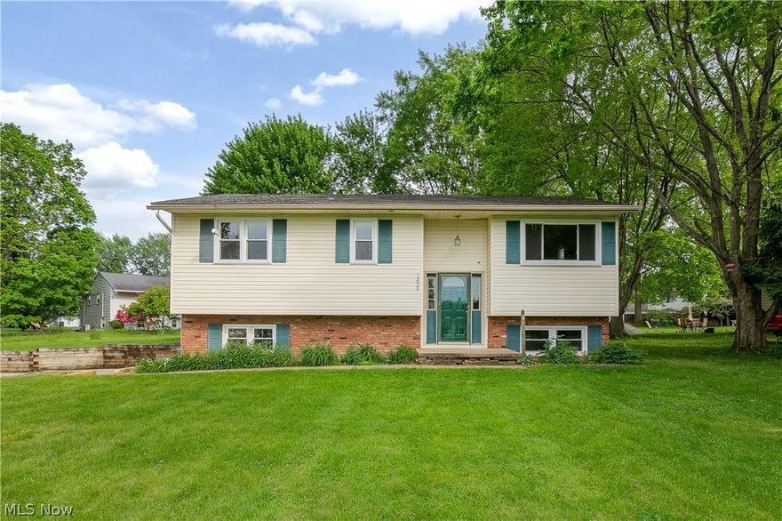 Beautifully maintained 3-bedroom, 1.5-bath bi-level located in desirable Suffield Township within Mogadore. Offering 2,228 sq ft on nearly half an acre, this home combines spacious living with serene surroundings. Recent updates include brand new carpet throughout (May 2026), new luxury vinyl plank flooring in the kitchen (May 2026), and a fully renovated full bathroom completed in 2021. Exterior improvements feature new deck steps and a retaining wall (May 2026), adding both function and curb appeal. Oversized 2-car garage provides ample storage and workspace. Move-in ready!