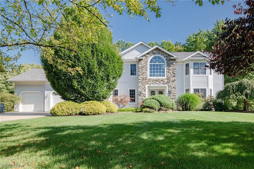 Wow! Move right into this stunning, extensively renovated colonial in Solon! This luxurious home has tasteful modern updates throughout, including kitchen and bathroom renovations. The front door opens into an elegant two-story foyer, with the formal dining room to your left and the living room to your right. Both rooms feature tray ceilings and newer LVT flooring that flows throughout the entire first floor of the home. French doors open from the living room to the family room, where you will find a beautiful stone fireplace. The kitchen includes gorgeous granite countertops, stainless steel appliances, a center island, and a dining area with sliders that open to the back deck. A large bedroom, a full bathroom, and a laundry room completes the first floor. Upstairs, you will love the luxurious owner's suite, which features a vaulted ceiling, two walk-in closets, and a stunning full bathroom that features a soaking tub beneath a skylight! Three additional bedrooms and a shared full bat