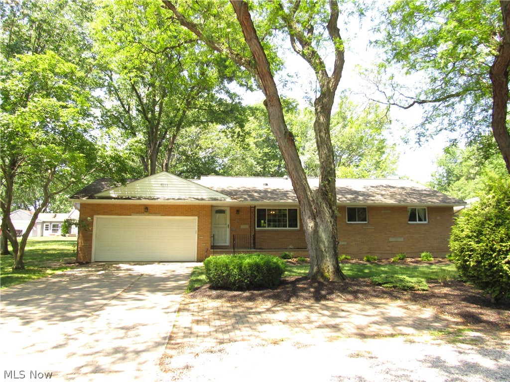 Location! Location! Location! Nicely updated five bedroom brick Ranch with two and a half bathrooms on almost 3/4 of an acre! Updated kitchen with granite countertops, stainless steel appliances, soft close cabinets, LED lighting, tile backsplash and a cabinet pantry. Family room has heated floors and slider leading to a composite deck. Nice refinished hardwood floors in the living room, dining room, hallway and bedrooms. Updated main bathroom with custom tile shower, big glass block window, his & her sinks and wired & plumbed for a first floor laundry room. Big basement has recreation room, bedroom, full bathroom, laundry room, mechanical area and a place for a workshop. Attached two car garage with water spigot, drain, door leading to the backyard and pull down steps to the attic. Walk to Metro Parks, City Hall Park, Recreation Center, baseball fields, walking trail and middle school. Beautiful mature trees and two sheds in the big backyard. Updated roof, furnace & AC and hot water tank. Includes one year home warranty!