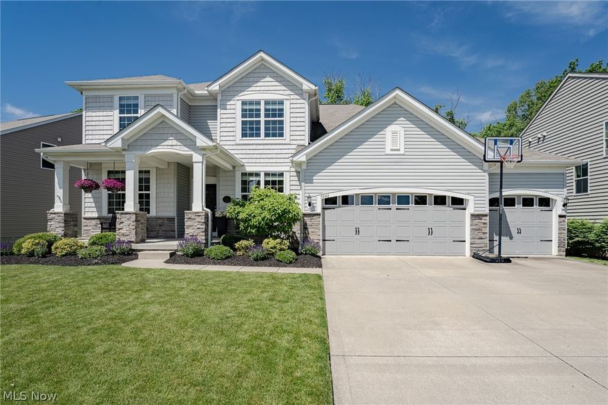 Move right into this beautiful contemporary colonial in Peninsula! This delightful home features over 3500 square feet of living space with 5 bedrooms, 4.5 bathrooms, spacious living areas, abundant natural light, a 3-car garage, and so much more! The front door opens from the lovely front porch into a welcoming foyer. On your right, there is very spacious formal dining room. On your left, french doors open to a generously-sized office. Head back the main, open-plan living area where you will find a very spacious living room with an elegant fireplace and a full wall of windows. The living room flows into the kitchen that boasts granite countertops, a subway tile backsplash, a walk-in pantry, and a full complement of stainless steel appliances. An eat-in area connects the kitchen to a sunroom at the back of the house with a sliding door to the back deck. A laundry room, mudroom, and powder room complete the first floor. A spacious, sun-filled loft at the top of the stairs leads to four bedrooms on the second floor. The primary suite includes an ensuite full bath, two walk-in closets, and a spacious bedroom. Across the hallway, a second bedroom also has an ensuite full bath, while two other bedrooms down the hallway share a third full bath. The walk-out lower level features a very spacious rec room, a fourth full bathroom, a fifth bedroom, and plenty of storage. Outside, there is a covered back patio as well as a raised deck. Don't miss this one - it will go fast!