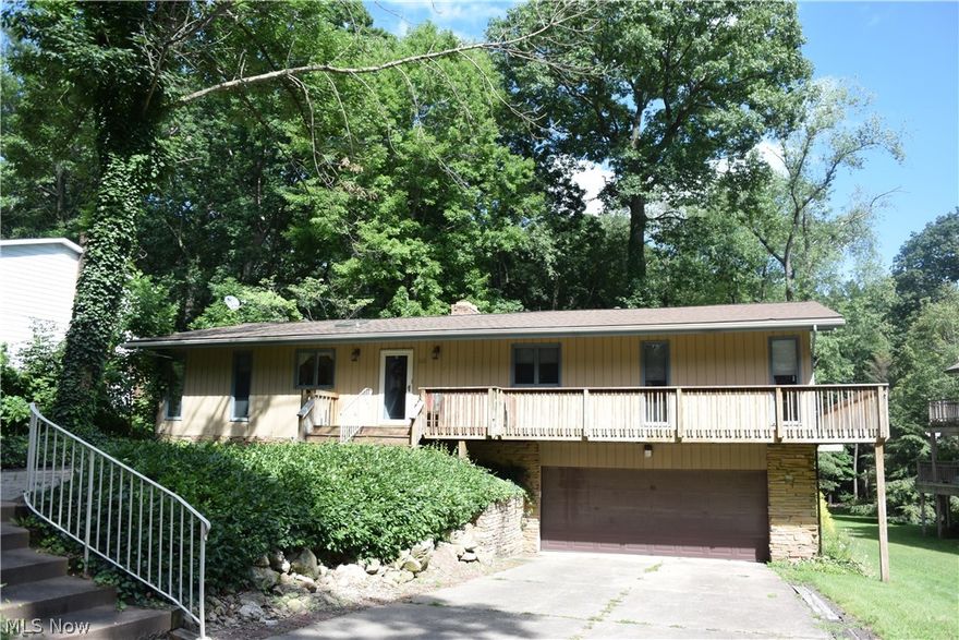 Amazing Ranch!!  Elevator located on 1st level to lower level.  Walk out Basement!!  Possible in law suite.  Lower Level has fireplace, full bath and living space.  4 bedrooms and 3 full baths.  Spacious living room with fireplace, sliding doors leads to a large deck.  Hot water heat plus forced air on 1st level.  Kitchen has lots of cabinets and granite counter tops.  Almost an acre plus a creek and wooded back yard.  Hot water heat for heating of the house.  Gas forced air is used for the central air.