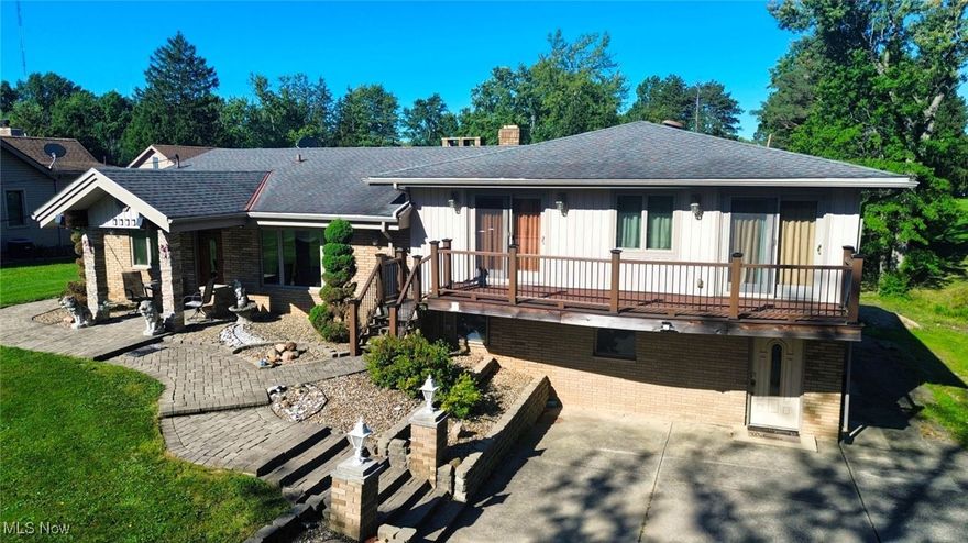 Balancing warmth, privacy, and architectural flair, this rare find offers space to live, work, and play in style. Tucked away on a quiet no-outlet road, this striking 4-bed, 3.5-bath split-level home delivers room to spread out and tranquility to unwind. Set on a full acre with an in-ground pool and sweeping stone terrace, it’s perfectly designed for elegant entertaining and effortless relaxation.

Inside, a dramatic black-and-white marble entryway sets the tone, leading into a sunlit living room where skylights crown the beamed cathedral ceiling and highlight the gleaming hardwood floors flow beneath. An expansive lower-level addition — with its own full bath and an airy vestibule — offers remarkable versatility, easily accommodating a family room, home theater, or additional private quarters. Upstairs, the primary suite is a haven of comfort and sophistication, with balcony access and three closets. The luxurious marble en suite features a combination whirlpool bathtub and hydromassage shower for a therapeutic escape. Three additional bedrooms share a beautifully appointed third full bath.

Last but certainly not least, a sun-drenched two-room loft perched above the 3-car garage offers boundless potential — from a serene studio or home office to a future guest retreat. Home warranty included for your peace of mind.