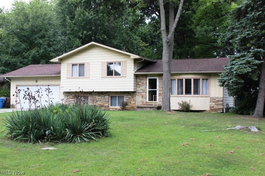 Open & airy 3 level split located close to the State Park on treed .59 acre lot offering 3 bedrooms, 1.5 bath & approx. 1446SF* Vaulted living room, sunken with wood floor* Vaulted formal dining with wood floor & new slider with access to private backyard; vaulted eat in kitchen with tile back splash, pantry & newer vinyl floor* Upper level with 3 bedrooms, full bath, ample storage, wood floors throughout except bathroom, ceiling fans & laundry chute* Lower level family room with gas log wood burning fireplace, laundry room, half bath & storage area (crawl space)* 2 car attached garage* Shingles (2009)* Furnace (approx. 4 yrs.)* Septic & Well completed (11/2016)* Neutral décor* Great location on quiet street* Possible immediate possession upon close*