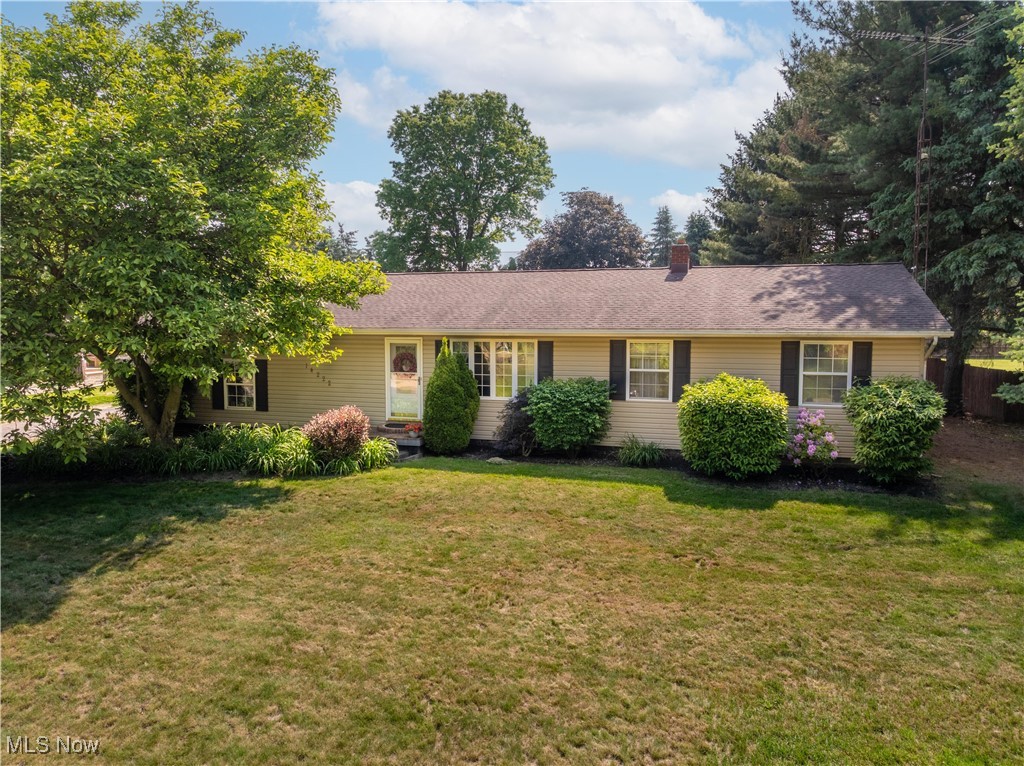 Discover this Spacious & Updated Ranch in Marlington Schools – comfort & convenience in this beautiful and bright 3-bedroom, 1.5-bath ranch with 2-car side-load garage situated on nearly half an acre. Built in 1978, this home combines classic charm with modern touches, offering space, style, and functionality throughout. Step inside to a freshly painted and welcoming living room filled with natural light and new luxury vinyl flooring, opening into the dining area and well-appointed Kitchen. The Kitchen comes fully equipped with a new range/oven, wall oven, new microwave, newer refrigerator, new dishwasher and new neutral colored counter tops, new sink and new sprayer faucet. There's pull-out shelving in the pantry—perfect for busy households. The adjacent dinette offers access to the backyard, ideal for indoor-outdoor living. One of the home’s most impressive features is the private master suite, boasting vaulted ceilings with exposed beams, tile flooring, and direct deck access. A bonus room with a half bath and walk-in closet adds flexibility and could double as an office (how they used it), nursery, or sitting room. 2 additional bedrooms share an updated full bathroom with dual sinks, making daily routines a breeze. Downstairs, enjoy additional living space with a finished recreation room—perfect for movie nights, a play area, or home gym. The full basement also includes an extra room that could be used as a Bedroom. A large unfinished section of the Basement offers laundry facilities, utilities, and storage shelves. Outside, unwind or entertain in the fantastic backyard, complete with a deck, patio, storage shed, raised garden beds & plenty of green space to enjoy the 4 seasons. A heat pump, new furnace & new hot water tank were recently installed. You'll feel out in the country yet close to shopping, eateries & wineries. This move-in-ready home offers peace, privacy and room to grow. Don’t miss your opportunity to make it yours—schedule a private showing today!