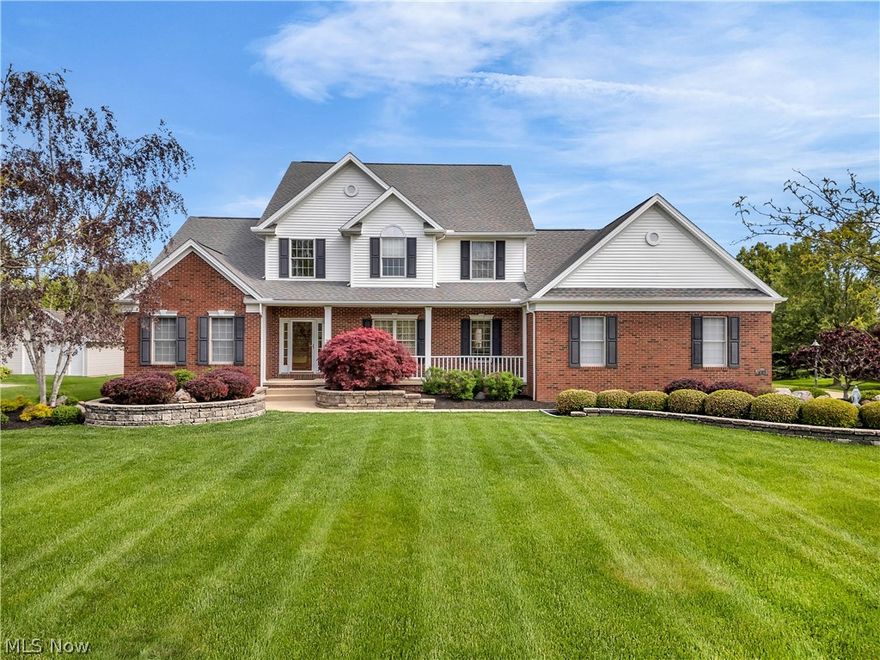 Must See and Must Read! This home has so much to offer. Beautifully maintained and move-in ready, this 4-bedroom, 3.5-bath colonial offers 4,365 sq ft of living space on a peaceful, beautifully landscaped 1-acre lot in Valley City/ Buckeye Local SD, no HOA fees. Step into the impressive two-story foyer with hardwood floors that opens to a dramatic two-story great room filled with natural light, featuring a stunning fireplace, detailed woodwork, and statement mirror. The spacious eat-in kitchen is designed for both everyday living and entertaining with granite countertops, Hickory cabinetry, tile backsplash, a large center island, double ovens, and a 6-burner range. The formal dining room adds charm with glass French doors, a glass pocket door, chandelier, and wall sconces. The first-floor owner’s suite is a true retreat with tray ceilings, a large walk-in closet, and en-suite bath featuring vaulted ceilings, double sinks, vanity area, Jacuzzi tub, dual shower heads, and a private water closet. First-floor laundry and a half bath add convenience. Upstairs, a hardwood hallway with custom display cabinetry overlooks the great room below and leads to 3 additional bedrooms, a loft area, full bath, and walk-in attic storage. The finished lower level adds over 1,100 square feet with high ceilings, a full bath, walk-up garage access, and endless possibilities for a rec room, home gym, theater, or guest space. The 3-car garage includes hot/cold water and a separate wall heater. Enjoy mornings on the expansive front porch or evenings on the composite deck overlooking the peaceful backyard. Additional highlights include: Public water/ sewer and natural gas, an irrigation system, whole-home generator, and prepaid lawn treatment for the remainder of the year. Upgraded home warranty included. Conveniently located near local shops, dining, parks, and Valley City’s beloved community events, this home offers space, comfort, and small-town charm.