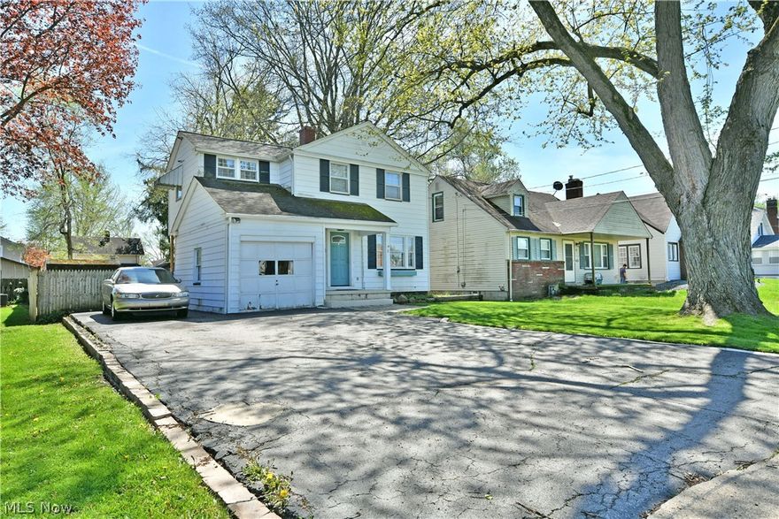Bright, beautiful and full of stylish charm, this two-story Boardman home has all the right moves and then some! Tucked away in a quiet neighborhood just minutes from highly desirable shopping and restaurant districts, this three-bedroom delight isn’t one to miss. Basking in the shade of a tall tree, the curb appeal continues with a single car attached garage and coved entryway with its bold, teal doorway. Adding to the allure, a fenced-in backyard features a fantastic corner patio for summertime relaxation. A large storge shed provides easy additional storage solutions. Step inside to find a wonderful living room, awash in natural light courtesy the lattice lined picture window, warming the hardwood flooring below. Sculpted archways lead to both the main staircase and nearby formal dining room that overlooks the kitchen. Here, tiled flooring joins the bright white appliances and cabinets that provide a clean, country-like aesthetic. Hanging lights over the extended countertop light the potential, additional casual dining. Meanwhile, a side door opens to instant backyard access. Upstairs, a trio of welcoming bedrooms graces the hall, each with their own style sets, ready for you to make your own. They are joined by a neatly tiled full bath with its matching shower surround. Laundry is located at the basement level along with a standalone commode.