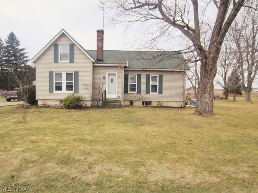 Charming Elyria Township farmhouse style home nestled on .70 acre lot*! Country atmosphere yet minutes from city conveniences. 30x30 detached garage w/ concrete floor plus a small outbuilding.  Updated & clean interior is decorated in modern/neutral tones- NO wallpaper plus there's hardwood floors in the main living spaces!  Oversized kitchen with oak cupboards. Formal dining room is spacious & light & airy. Updated full bath. Nice sized living room. First floor master bedroom has three closets. Upstairs bedroom provides a walk in closet or dressing room or even small office space!  Downstairs you'll also find a cozy sitting/sunroom overlooking the backyard! Main level laundry room. Vinyl sided with vinyl replacement windows. Central air added 2014.  A great value if you're seeking more than a half acre lot and a move-in ready home at an affordable price!