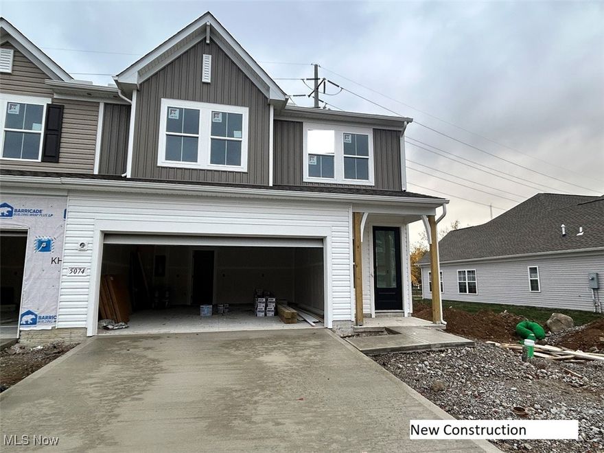 If you fell in love with our model home, Lot 42 is your chance to make that dream a reality. This beautiful end-unit townhome showcases the same Farmhouse styling—bright and timeless with black accents, added windows that flood the home with natural light, and 9-foot ceilings on the first floor that create a spacious, open feel. The kitchen blends practicality and design with 42-inch white shaker cabinets, steel gray leathered granite, and GE Café appliances, including a 30-inch gas range and refrigerator. Just off the kitchen, the laundry room adds both comfort and convenience, complete with a washer, dryer, and utility sink. The first-floor primary suite offers the perfect retreat, while upstairs provides two additional bedrooms, a second full bath, and an inviting loft that’s ideal for an office, workout area, or cozy lounge—all beneath 8-foot ceilings. Thoughtful touches throughout—like a warm fireplace, ceiling fans, and well-planned storage—create a home that feels as functional as it is beautiful. The HOA handles the yard, snow removal, and exterior maintenance, leaving you free to enjoy nearby Historic Downtown Willoughby just 2.5 miles away. With quick access to major highways, commuting to Downtown Cleveland or major employers such as Progressive Insurance, Parker Hannifin, Avery Dennison, Cleveland Clinic, or University Hospitals is quick and convenient. Move-in ready mid-January.