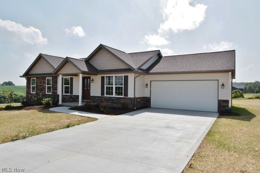 NEW CONSTRUCTION! MOVE IN READY!! Enjoy the peaceful serenity of the Oakwood North subdivision. This custom built spec home from Schlabach Builders offers many details that you will love. From the custom cabinetry to the cathedral ceilings. Stone and Vinyl exterior offer a great street appeal.  Relax with that morning cup of coffee in the beautiful sunroom.  Take a stroll down to the common area of Oakwood for that great summer picnic with the family. Contact us today for more details and a personal showing.