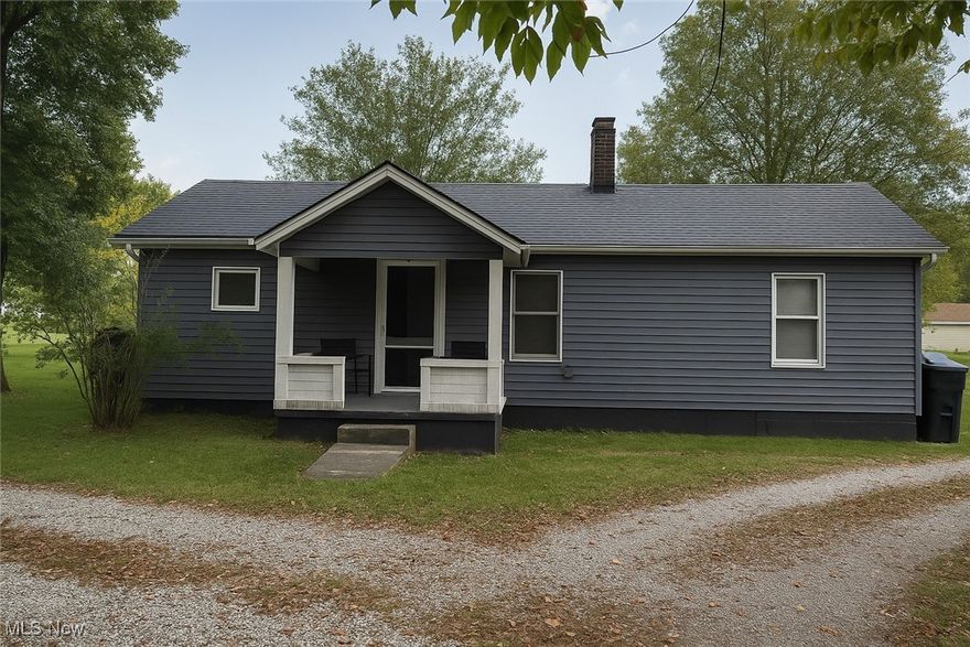 This 2-bedroom, 1-bath home offers convenient single-level living with a functional layout and plenty of potential. The interior includes a spacious kitchen with generous counter space, a comfortable living room, and a laundry area for added ease. An enclosed back porch provides additional storage or seasonal space. Outside, the property features a detached 1-car garage, a yard for outdoor use, and frontage along the creek, adding a peaceful natural backdrop.