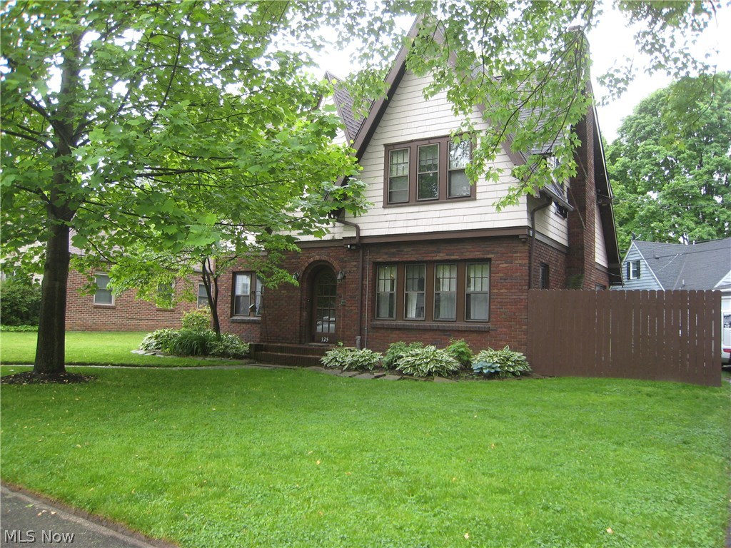 This charming Tudor home is situated in a desirable West Akron neighborhood. The first level of the home has an inviting living room with a fire place, There is an extra room for an office or study. The home has its original hard wood floors that have been recently refinished. The formal dining room has the original wood work and so much character. There is an eat in kitchen with a breakfast nook. A half bath on the first level as well. There are 4 spacious bedrooms and 2 baths upstairs, hard wood floors and a master bath. The basement is partial finished with an extra room, could be a game room or extra bedroom. There is a 2 car attached garage. Most of the first level has ben freshly painted. Homewarranty is included.