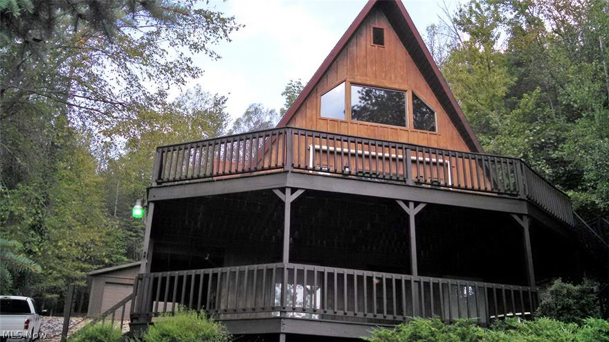 Beautiful home in private gated Lake Mohawk.  24 x 28 garage.  Main floor has updated cherry kitchen, great room w/vaulted ceiling, walkout to huge deck overlooking lake, one bedroom and full bath.  Second floor loft bedroom.  Finished lower level with large rec. room, one bedroom, full bath and walkout to large lower deck.  Concrete driveway.  New carpeting throughout.  Enjoy all that Lake Mohawk has to offer!  Good year round home or get-a-way retreat.  Close to rear Keno Rd. gate.