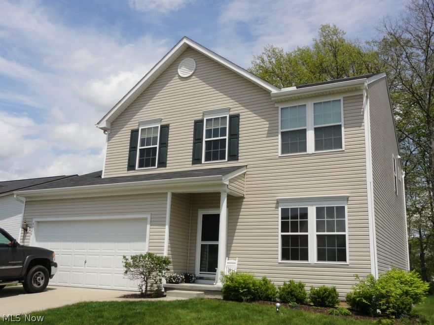 Gorgeous 2009 construction (Florence Model) with private wooded view out back! Upgrades & Updates are everywhere! ’13 Laminate flooring living, great rm, dinette and kitchen. ’12 Additional finished space in basement. Upgrades of 9 ft ceilings, raised panel kitchen cabinets w tile backsplash, High Efficiency Furnace, dual sink master bathroom & much more! Potential 4 bedroom home w an upstairs loft/play area easily enclosed as additional bdrm. Spacious living rm, ½ bth w pedestal sink  and big great rm w open layout to eating area and roomy kitchen featuring an island w breakfast bar & walk in pantry. 1st flr lndy too! Paver patio, storage shed & rare wooded view of common space- one of the premium lots! Mst suite w walk in custom closet & mst bth w 2 sink vanity, linen closet & shower/tub. Giant finished basement with expanded rec rm includes a bar & built in storage. Addtl 150 Amp panel & good storage. Security system, hard wired smoke detectors all in a sidewalk lined neighborhood