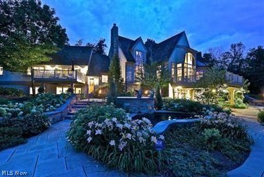 This magnificent French Provincial style estate is incredibly private on 7+ acres w/4 car attached garage. Inspired by Tony Paskevich with extensive attention to detail. The main house is 8,472 sq. ft. with first floor living featuring a completely updated kitchen, including a 5’ La Cornue range imported from France, and Botticino marble flooring in the eating area. There is a two story library w/beautiful built-ins on both floors and a fireplace. The master suite was renovated in 2015 w/Calacatta gold marble flooring, large glass shower, tub and an enormous walk-in closet. The upper level offers a guest, in-law, teen or nanny suite w/living area, kitchen, bathroom and bedroom w/access to the elevator. There are 2 additional tandem bedrooms each w/bath. These lead out to the front hall overlooking the two-story great room and access to the 2nd floor library bookshelves. The lower level offers a work-out room, wet bar, wine cellar, media room w/gas fireplace, game room and powder room. Off the media room are French doors out to the manicured grounds that boast a pond w/gazebo, in-ground pool, spa, water feature, and reflecting pool. It leads you to the 1,600 sq. ft. carriage house w/large 2-car attached garage, kitchen, powder room, changing room, and screened-in porch w/fireplace. The second floor offers a great room, bedroom, bathroom and a fabulous sleeping porch! SEE THE ATTACHMENT FOR MORE DETAILS.