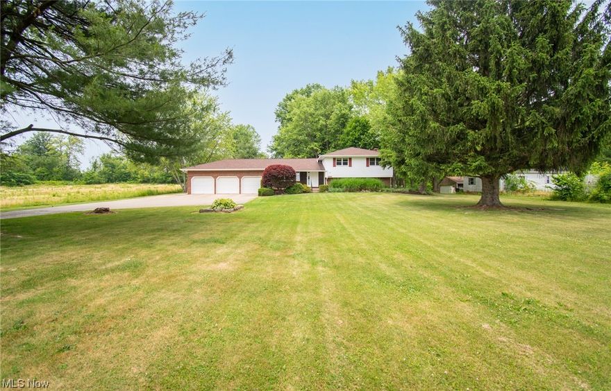 Come take a walk through this 2272 sq ft. 3 bedroom, 3 bathroom split level house with ample closet space. Enjoy the peaceful country setting while sitting on your back deck overlooking your fenced backyard on 4.5 acres in Springfield schools. Don't miss the large cedar beams through the main level of the house, the top rock stone fireplace (serviced in 2023) and 3 car garage with workshop space AND loft area plus a backyard shed. Wired for whole house generator.

Updates include Roof 2016, HWT 2020, house painted 2021, central air 2022, furnace 2023

Property includes 2 parcels totalling 4.5 acres. Additional property can be kept or resold, used for livestock, etc.