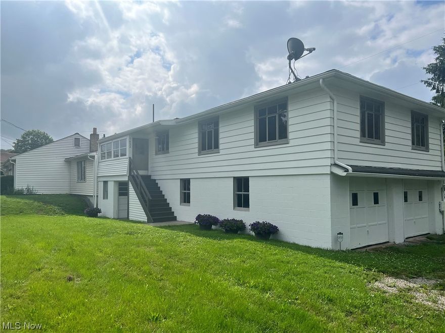 Wonderful Investment Property! Get both homes for the price of one! (Selling with 7624 Brown St) Live in one and rent the other.  This home is spotless and has many updates, which include: all new wood flooring, and above grade carpet, Fresh paint throughout, and completely remodeled bathroom (all bathroom accessories stay) Enjoy all the natural lighting in the large living room and large bedroom. Have several people help you cook in the spacious kitchen that includes a new glass top oven. On rainy nights be thankful for the large attached 2 car garage. Like to do projects? Enjoy the separate workshop that includes a half bath. Do not miss out on this wonderful opportunity, schedule your private tour today!