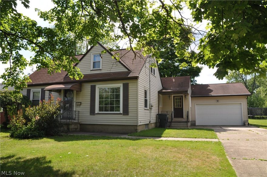 This charming residence has no shortage of amenities with 4-5 bedrooms, 3.5 bathrooms, with over 1900 sq. ft. of living space. On the main level, there is a formal living room and dining room, a fully-equipped kitchen, family room with gas fireplace, and 2 bedrooms with 1.5 bathrooms. Upstairs, you'll find 2-3 additional bedrooms and another full bath.  The basement of this home has a second kitchen, laundry facilities, a bar for entertaining, and an additional full bath. Sliding glass doors off of the family room lead you to the back deck which overlooks a spacious lawn and fertile garden space. This spacious home has a 2 car garage, a new water heater and electric service, glass block windows in the basement, and hardwood floors in all rooms except the dining room, kitchen, family room, and upstairs back bedroom.