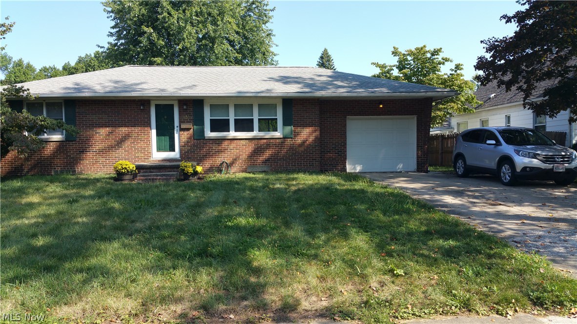 Fantastic 3 bedroom, 2 bath Brick Ranch home with attached garage, large private partially fenced yard, hard wood flooring and full finished basement! Super sized laundry room with ceramic tile flooring. Bonus room in basement with ceramic tile flooring would make perfect office, work out room, play room or craft room! Huge finished recreation room with carpet and gorgeous knotty pine wood paneling! Great location close to shopping, dining, schools and parks. Fast highway access too! Wonderful neighborhood! Schedule your showing today!