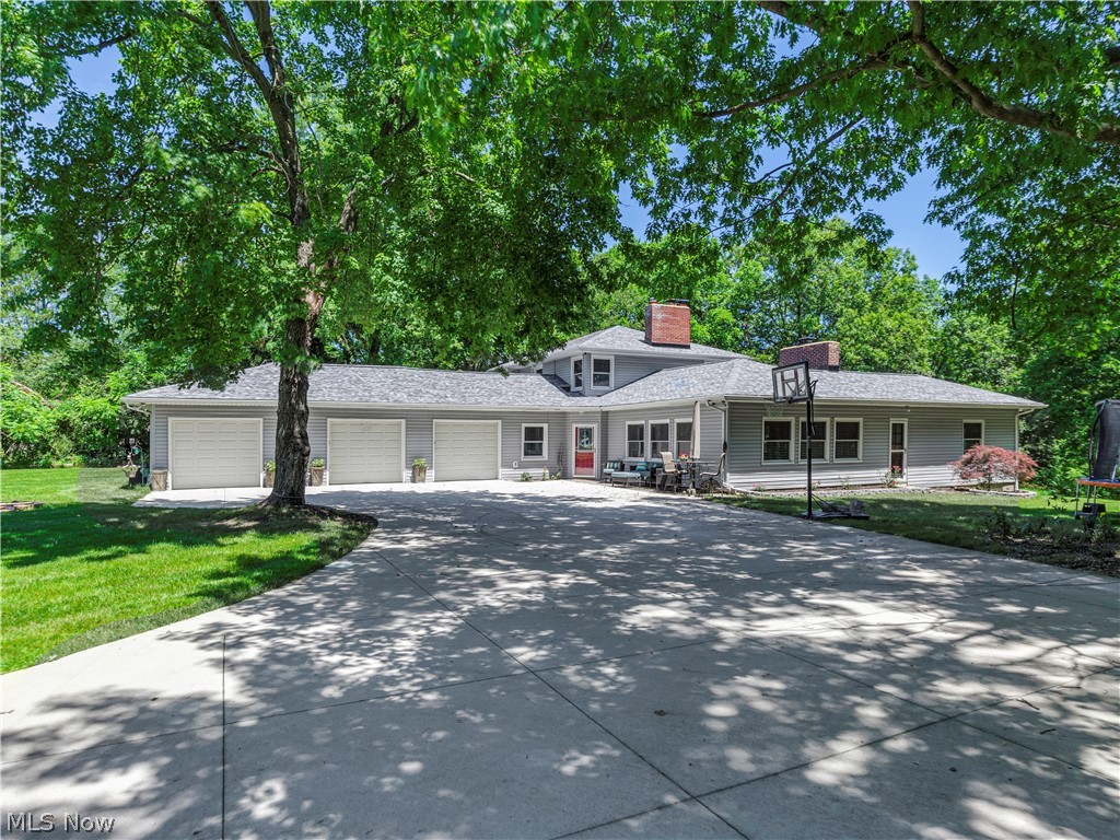 This is the one you have been waiting for. ACREAGE, PRIVACY, OVER 2700 SQ FT OF LIVING SPACE, MOVE-IN READY, ATTACHED 3 CAR GARAGE! Now that I have your attention let me tell you about the updates. Windows, siding, hot water tank and second floor Bath 2014. Concrete driveway and patio 2017. A/C 2018. 1st floor bath and Kitchen with granite countertops and stainless-steel appliances including a double oven in 2018. Luxury Vinyl flooring 2018. Tie in to public sewer 2018. Roof 2019. Freshly painted in trendy greys and blues this spectacular home also offers two wood burning fireplaces, heated tile flooring in the impressive family room, a formal living and dining area, more cabinet space than you can imagine in the fabulous kitchen, a 1st floor master bedroom and spacious laundry room. The office/playroom/5th bedroom completes the first floor. The second floor offers 3 nicely sized bedrooms and a stunning updated bath. You like the outdoors? Patio, hot tub, tree house, magnificen