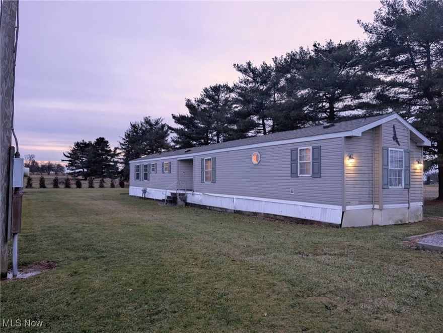 Charming 3 bed, 2 full bath manufactured home with a rear deck and 2 sheds for added storage. Updates include new bathroom flooring and a sliding door installed approximately 4 years ago. A great opportunity for easy living with outdoor space.