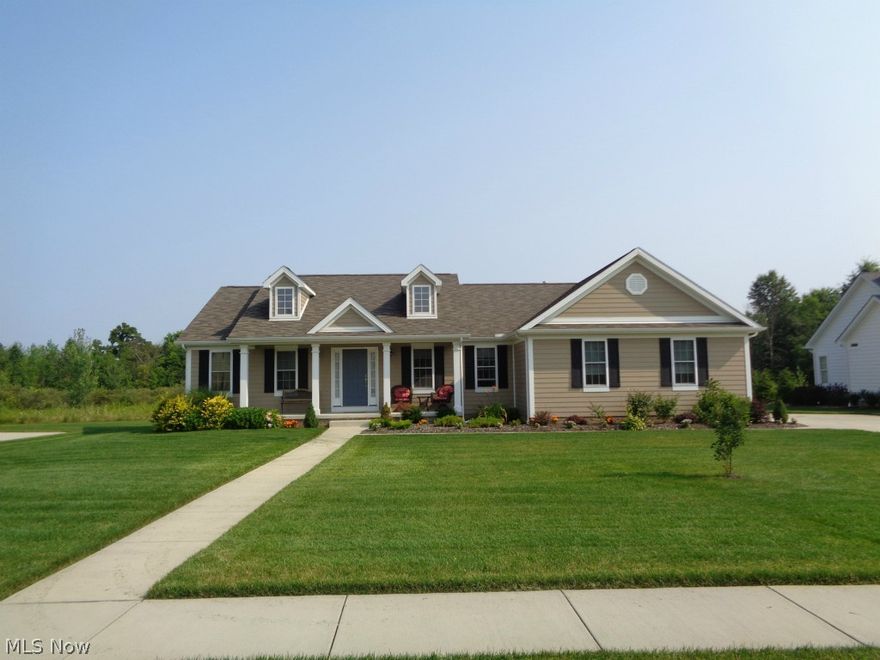 This beautiful custom built home has many features designed for modern living with open floor plan, black granite surround on gas fireplace, hardwood floors and a formal dining room.  The kitchen has matching black granite countertops, stainless steel appliances & beautiful cabinets.  Kitchen dinette leads to the deck and large back yard through the sliding glass doors.  Master bedroom offers a large walk-in closet, split dual sinks, jacuzzi tub, walk-in shower and second closet in bathroom.  Sliding doors from master bedroom make it easy to enjoy the outdoors.  This home features James Hardie Siding. The desired Ridgley Park development offers sidewalks and street lights.  I'd love to show you this beautiful home.