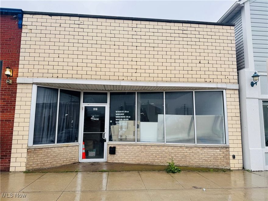 Positioned in the vibrant heart of downtown Lorain, this property offers more than 3,500 square feet of flexible, usable space. With large front-facing windows perfect for visibility and branding, and rear garage access for added convenience, this location is ideal for a variety of uses—retail, office, studio, or creative space. Surrounded by steady foot traffic and downtown energy, this blank canvas is your opportunity to bring a unique vision to life in a prime location.